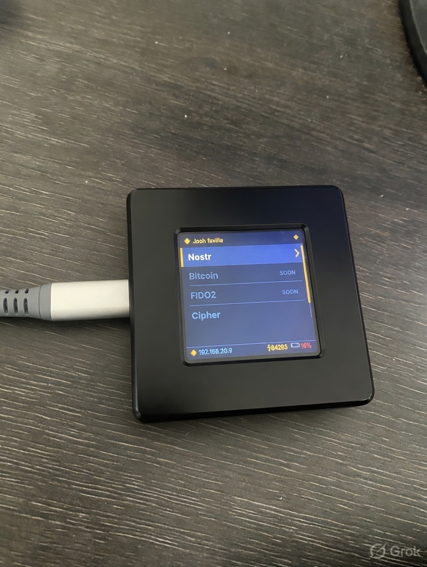 Favilla KEY device showing protocol menu — Nostr, Bitcoin, FIDO2, Cipher